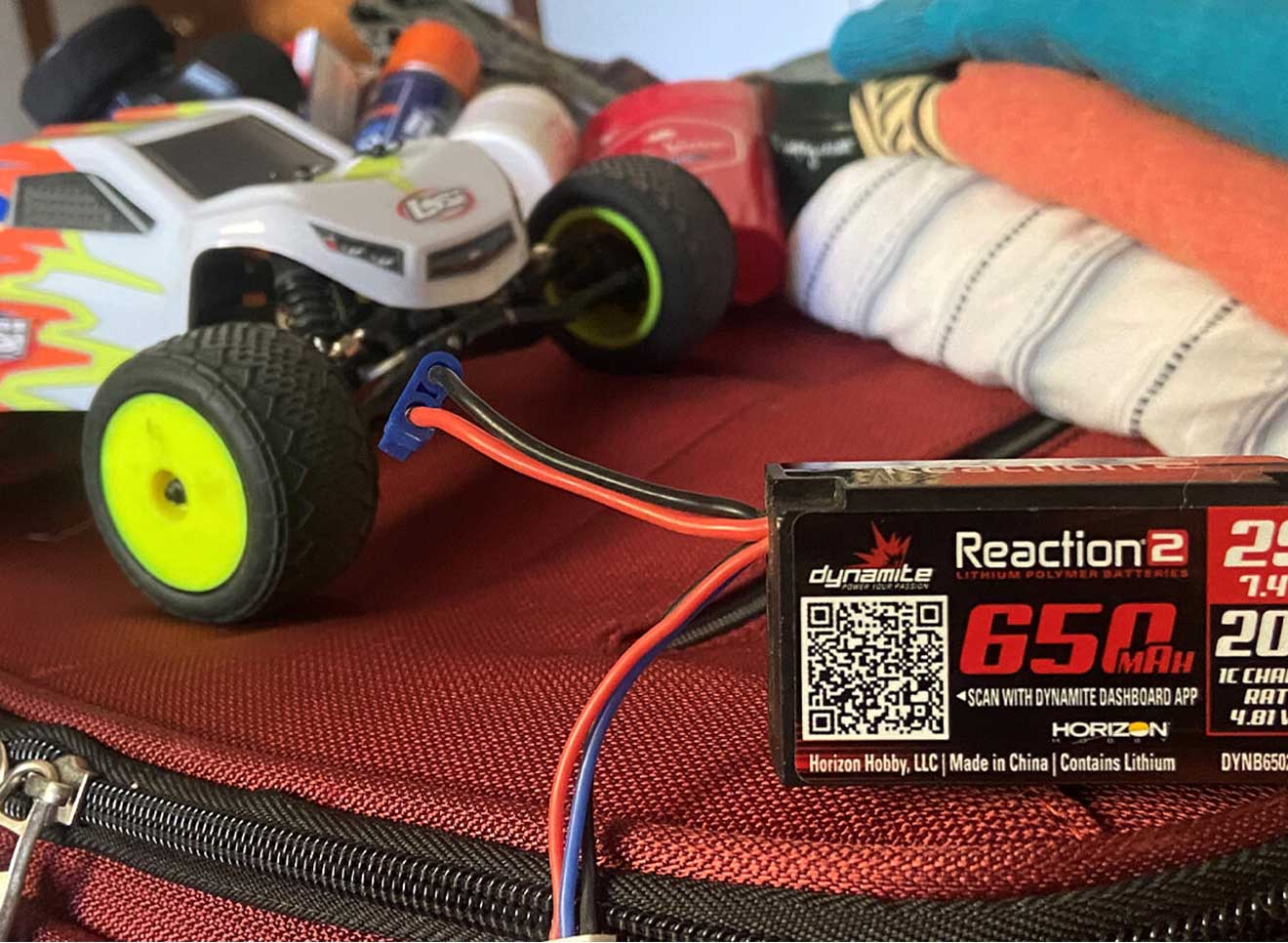Image of a Spektrum LiPo battery atop a suitcase.