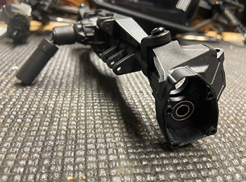 Using M3x4X10mm shoulder screws (AXIC4403), fasten each knuckle to the axle.